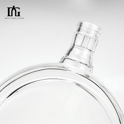 Durchsichtige Getränkglasflasche mit Goldkappen